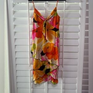 Trina Turk floral spaghetti strap dress  with orange pink black green accents .